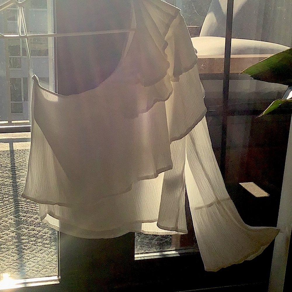 Size small white flowy asymmetrical top